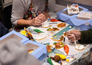 Residents participating in a cookie decorating workshop