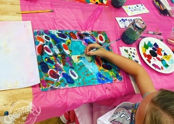 Child creating a craft with Createry Workshops