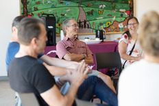 Residents speak during First Fridays Coffee at the Superior Community Center
