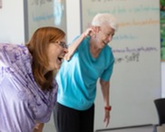 Seniors laughing at a Bingocize class