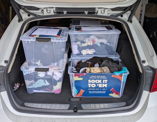Donated socks in the trunk of a car