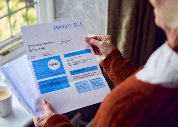 A person examines an energy bill