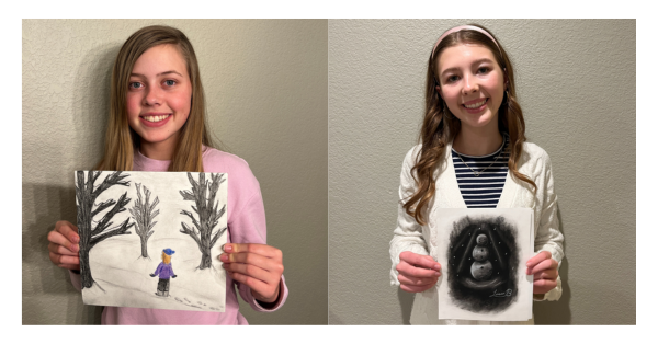 Jane and Livia from Superior pose with their winning artwork 