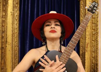 Melissa Ivey holding a guitar