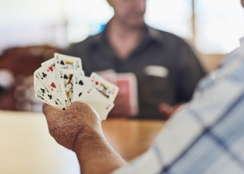 Senior playing poker