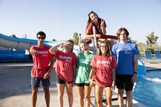 Pool staff members pose in silly ways for a group photo at Superior's South Pool
