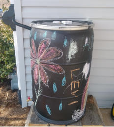 A decorated rain barrel
