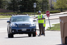Person directing people during the hard to recyle event.
