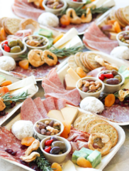 Charcuterie plates and boxes with meats and cheeses