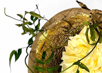 A floral design with a yellow flower