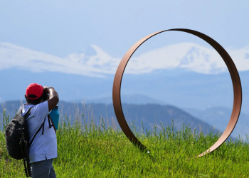 A photographer captures a public art piece along McCaslin Boulevard in Superior