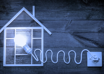 House with a light bulb plugged in