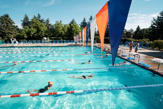 Swimmers take laps at the North Pool
