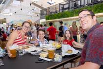 Family eating BBQ during the 4th of July Celebration.