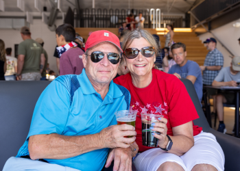 Two people pose for a photo at the Superior Community Center BBQ on the 4th of July