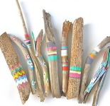 pile of painted sticks on a white background