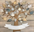 wooden tree with painted craft leaves on a wooden deck background