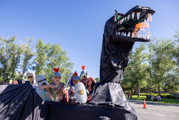 Kids on a dragon float.