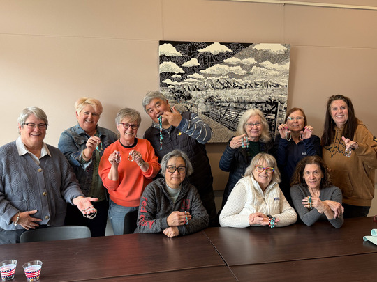 A group of Superior Seniors pose with jewelry made in a crafting class at the Superior Community Center