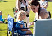 A young girl gets a rainbow painted on her face at the Superior Summer Market