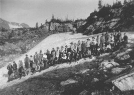 Historic Photo of hikers standing in the snow on the trail.