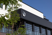 photo of the downtown superior civic space against a blue sky backdrop with a green tree partially covering view