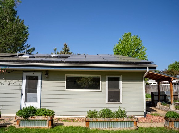 A home in Boulder County soaks up the sun with its rooftop solar panels.