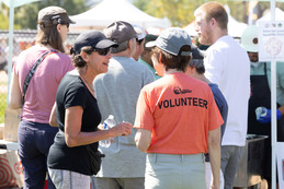 Volunteer talking during the Chili and Beer Fest.