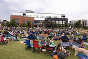 People in the Downtown Superior Plaza enjoying a concert.