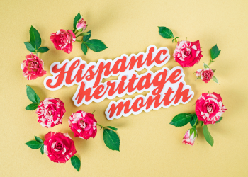 Hispanic Heritage Month in red text surrounded by red roses on a yellow background