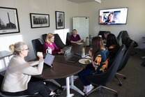 Members of the Advisory Committee for Environmental Sustainability sit around a table during a meeting