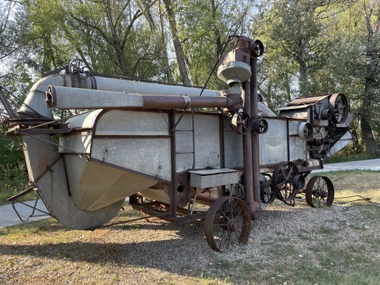 Large mettle thresher located in Grasso Park.
