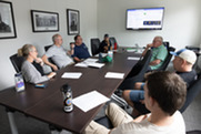 Members of Superior's veterans group sit around a table at the Superior Community Center and discuss topics 