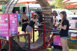 Person running on the hamster wheel powering the snow cone machine.