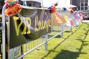 VIP Lounge sign hangs on a fence at the Chili & Beer Fest