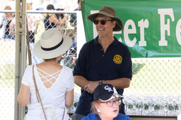 Member of the Rotary Club of Boulder Valley talking with a festival participant. 