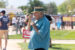 Person attentively eating chili.