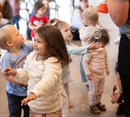 kids chasing bubbles at the SCC