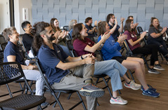 group of people clapping at the superior civic space