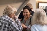 group of senior women laughing at the senior welcome breakfast