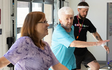 2 seniors copying workout from instructor