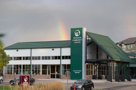 Exterior of the Superior Community Center with a rainbow