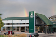 Exterior of the Superior Community Center with a rainbow