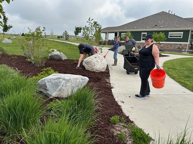 Residents work on a project through the Neighborhood Sponsorship Program