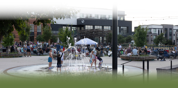 Superior Plaza full of people enjoying a Summer Concert.