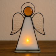 Stained glass angel with candle behind it