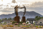 Large sculpture in the roundabout on McCaslin Boulevard in Superior with sunset mountain backdrop