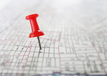 red push pin on a map
