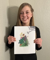 A young girl holds a piece of art featuring a woman surrounded by flowers being watered by a watering can
