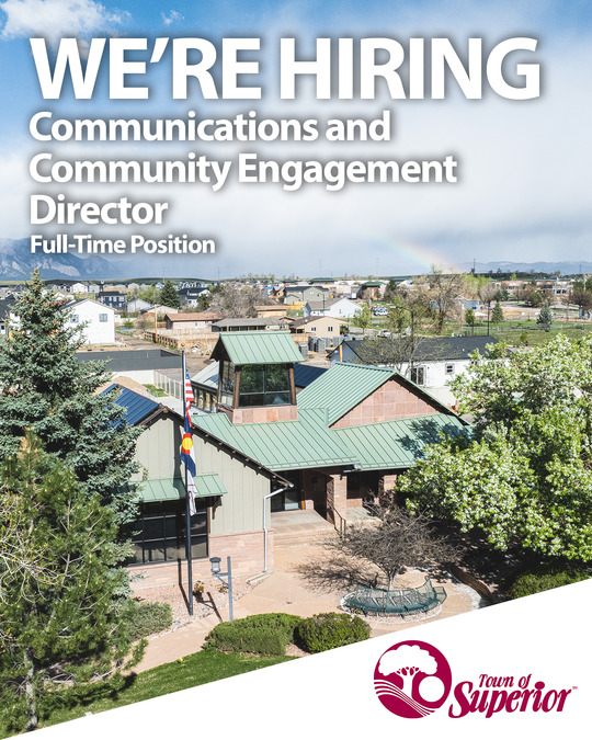 We're hiring text overlaying an aerial photo of Superior's town hall with a rainbow in the background.